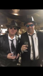 Wayne and David Brannigan posing in Blues Brothers outfits